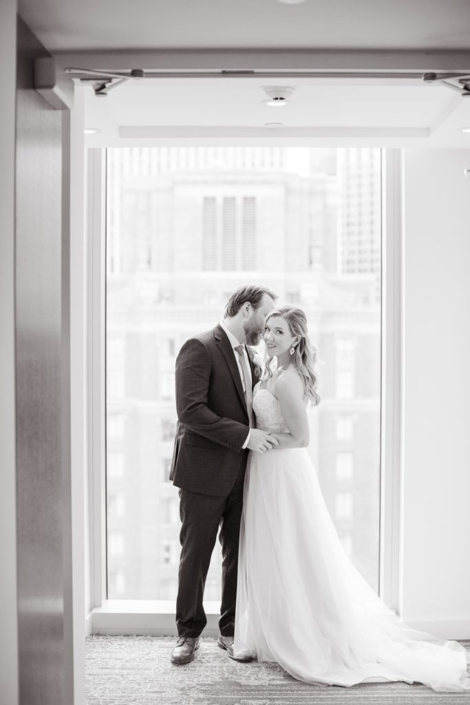 A bride and groom share a secluded moment at a chic hotel Alessandra in downtown Houston Texas.